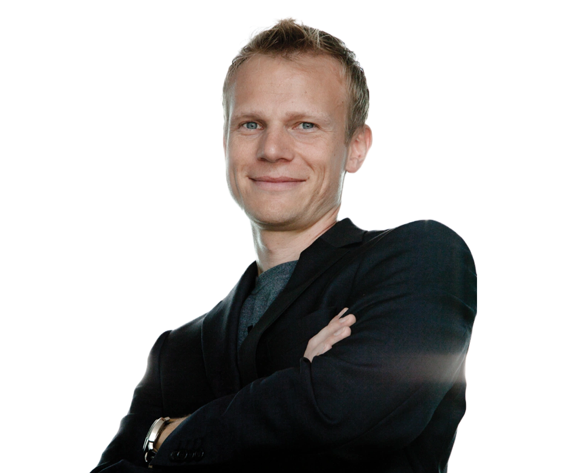 Portrait of Helmut Juskewycz, CEO and Co-Founder of LingoHub, smiling with arms crossed in a dark blazer against a transparent background.
