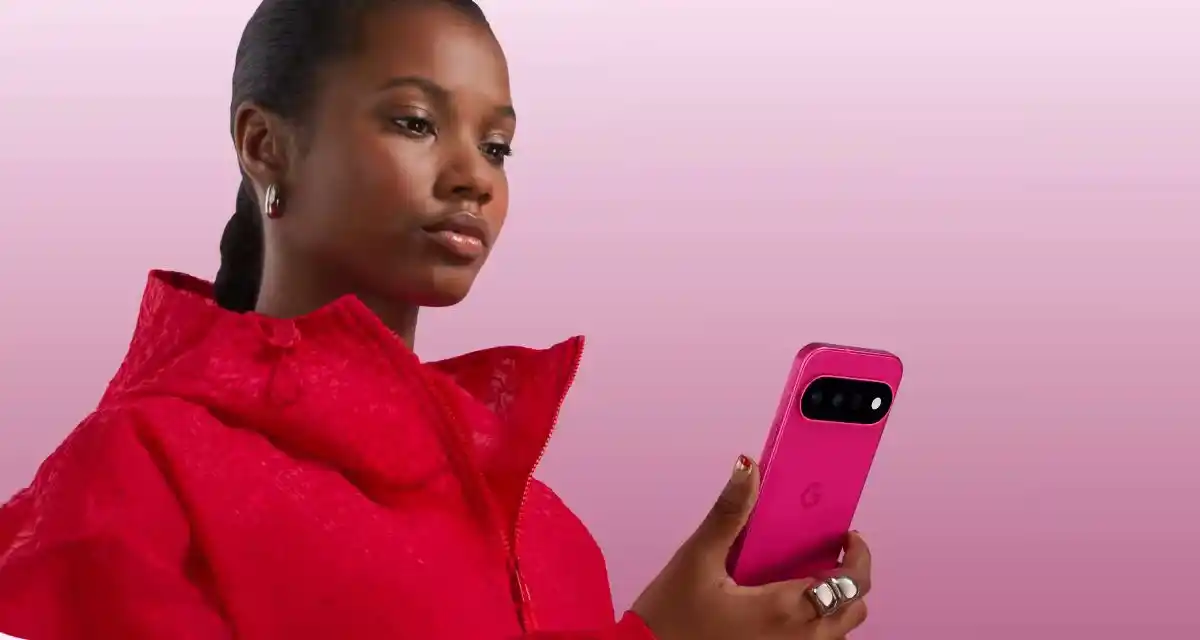 A woman holding a pink Google Pixel 11.