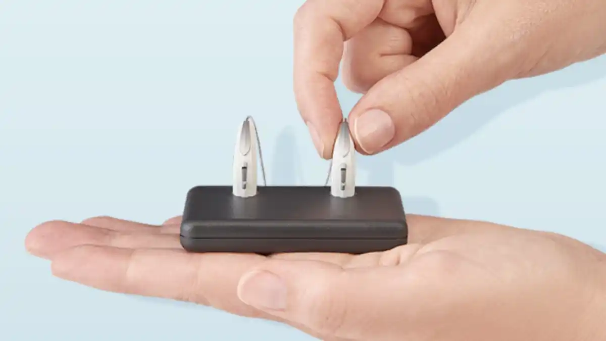 Set of Starkey Start Hearing OTC hearing aids in charger