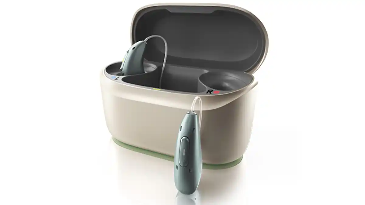 Photo of Infinio Ultra Sphere hearing aid and its rocker-switch