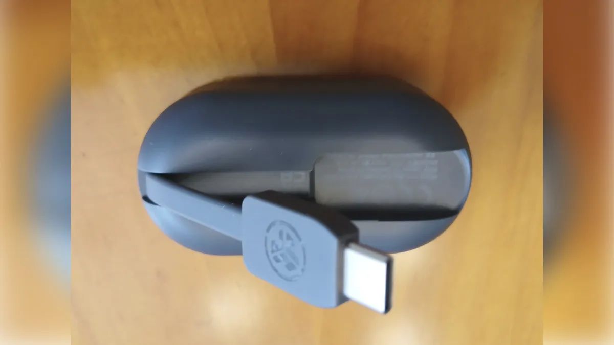 The back of the portable charging case has a handy built-in recharging cable.