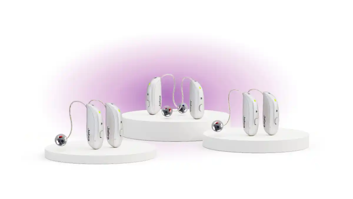 Three silver receiver-in-ear hearing aids