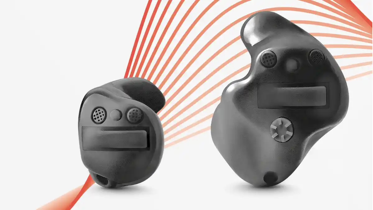Closeup of Signia Insio IX in-the-canal (ITC) and in-the-ear (ITE) hearing aids.