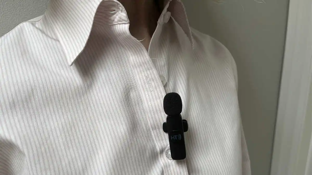 Photo of a remote mic clipped to a dress shirt