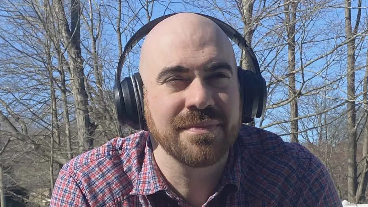 Yuni Founder Dan Glass with headphones on outdoors