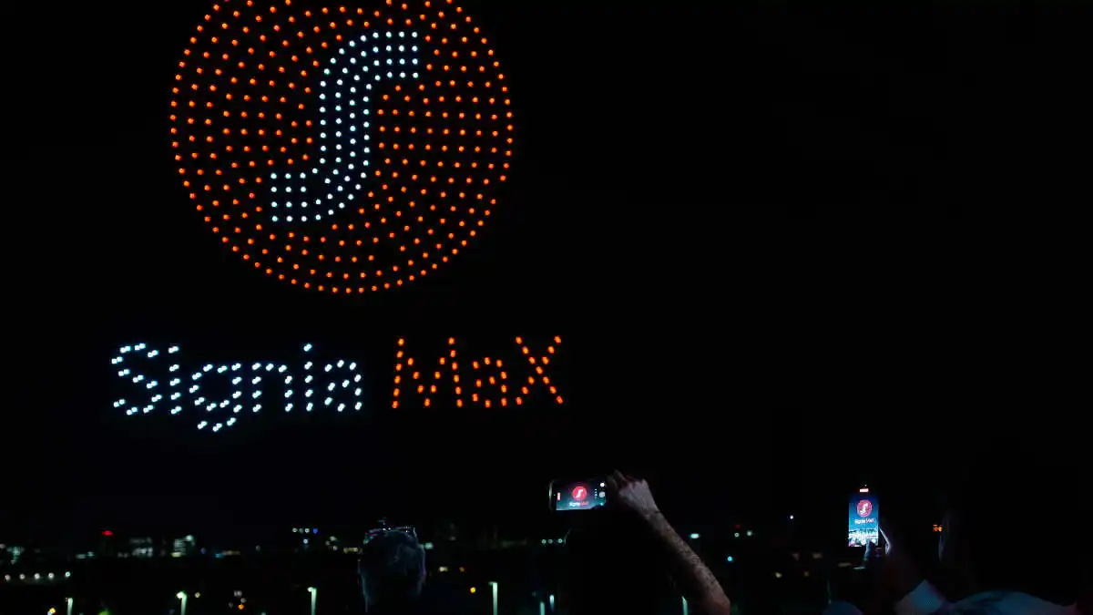 A custom drone show with Signia MaX imagery lit up the night sky in a rooftop finale.