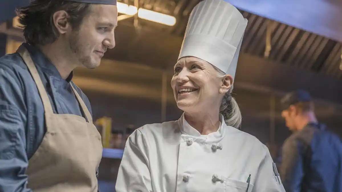 Photo of a chef with Beltone Serene hearing aids in busy kitchen