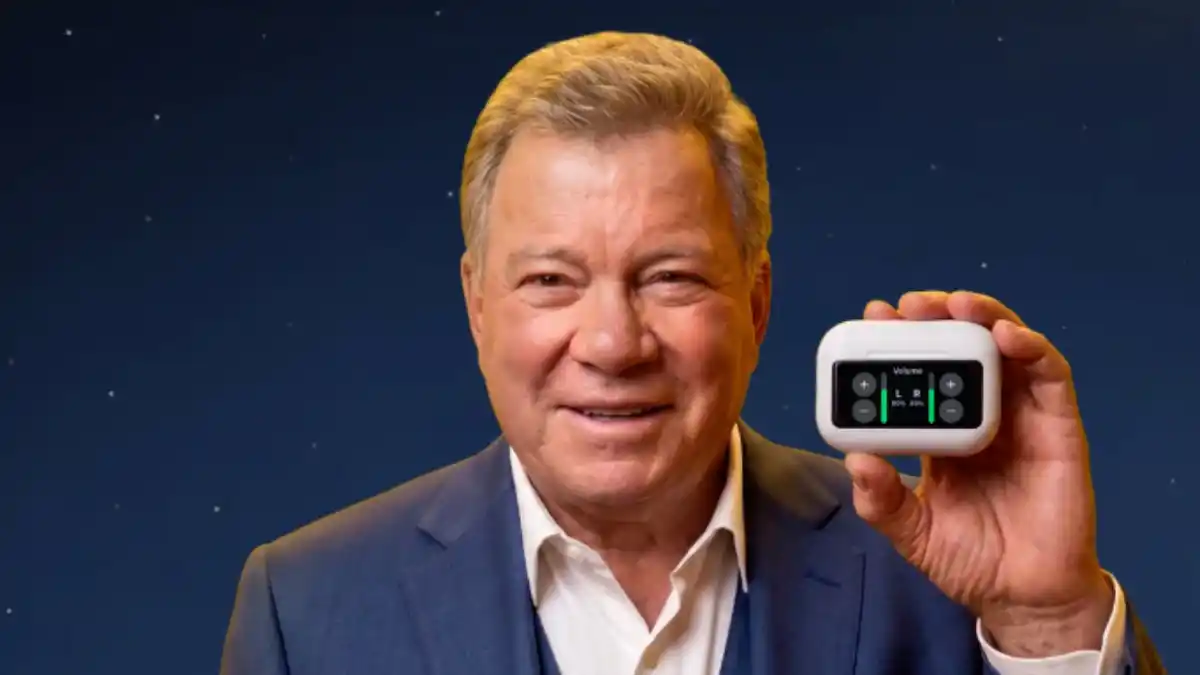 William Shatner with an Audien Atom X OTC hearing aid.