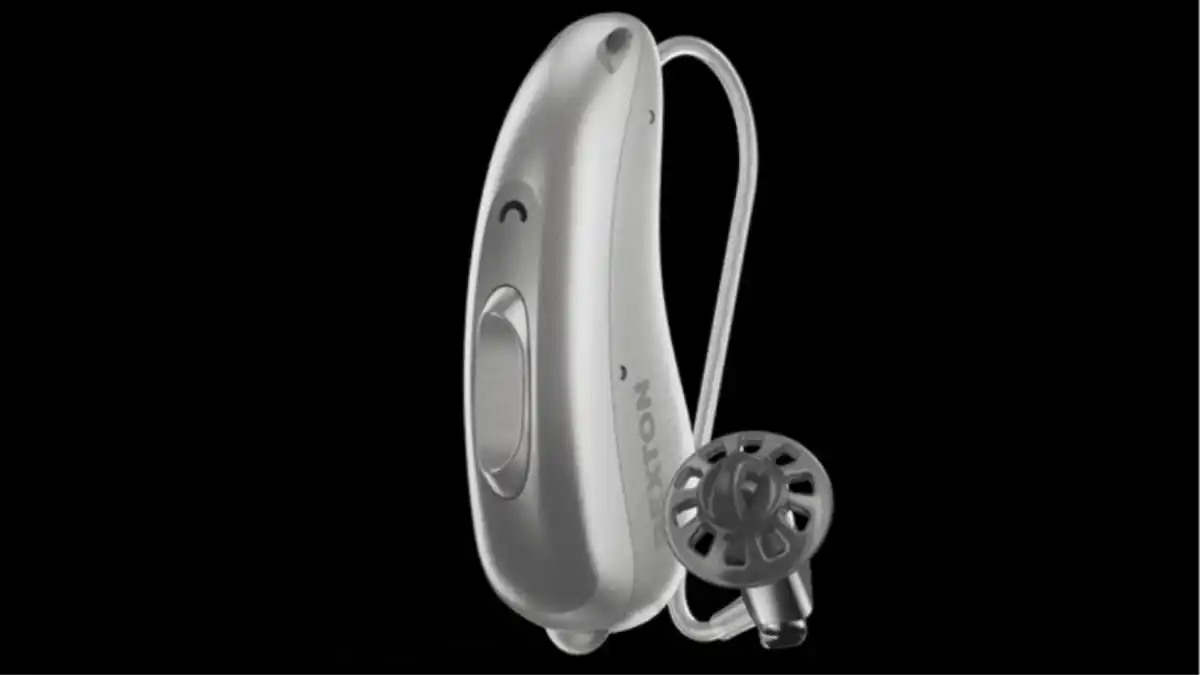 A silver Rexton BiCore 312 battery powered hearing aid