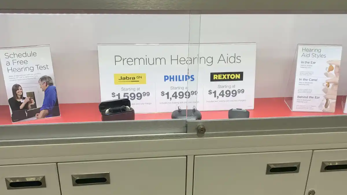 Costco display case showing Jabra, Philips, and Rexton hearing aids.