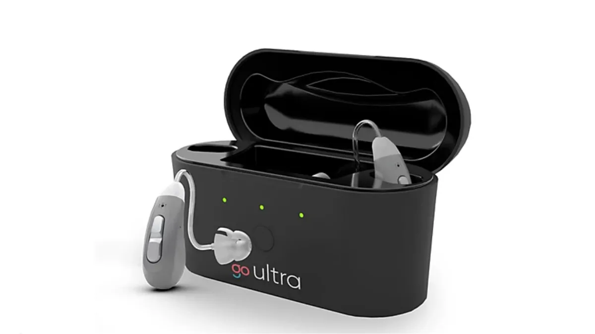 Go Ultra hearing aids with recharging unit.