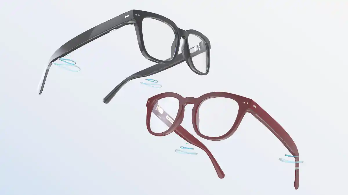 Six microphones (the three silver ports on each side of the glasses) gather and process the sound, then deliver it to the ears via receivers near the back of the temples. The hearing glasses are currently available in two sizes and two colors (shiny black and burgundy). Photo courtesy of Nuance Audio.