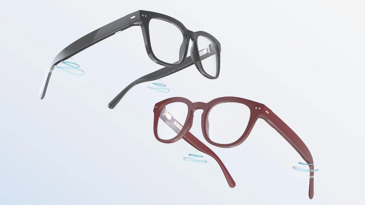 Six microphones (the three silver ports on each side of the glasses) gather and process the sound, then deliver it to the ears via receivers near the back of the temples. The hearing glasses are currently available in two sizes and two colors (shiny black and burgundy). Photo courtesy of Nuance Audio.