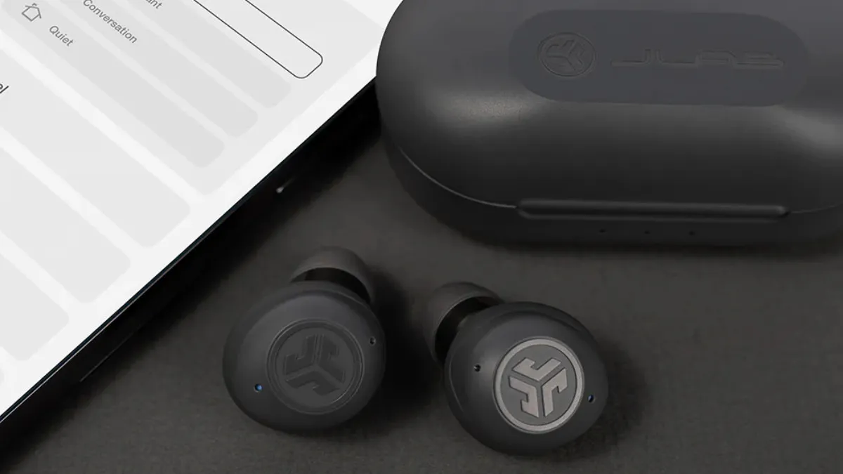 JLab HEAR earbuds, portable charging case, and Hearing Health App.