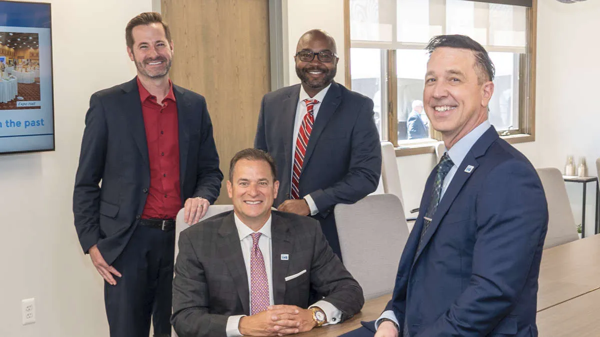 Signia Hearing President Mike O’Neil and Vice President of Commercial Sales Michael Guiden (both standing) with IHS President-Elect Michael Andreozzi and IHS President Patrick Kochanowski (both seated) in the Signia-sponsored IHS Conference & Learning Center.