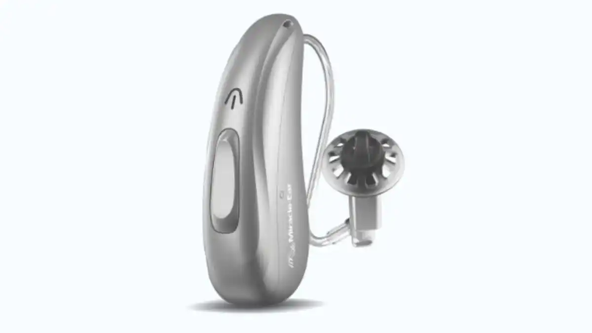 Silver Miracle Ear Genius X receiver-in-canal hearing aid on light blue background