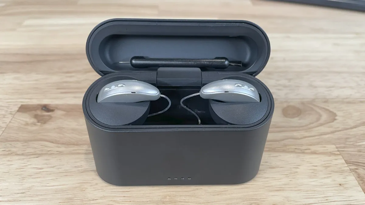 Edge AI hearing aids recharging in the portable case.