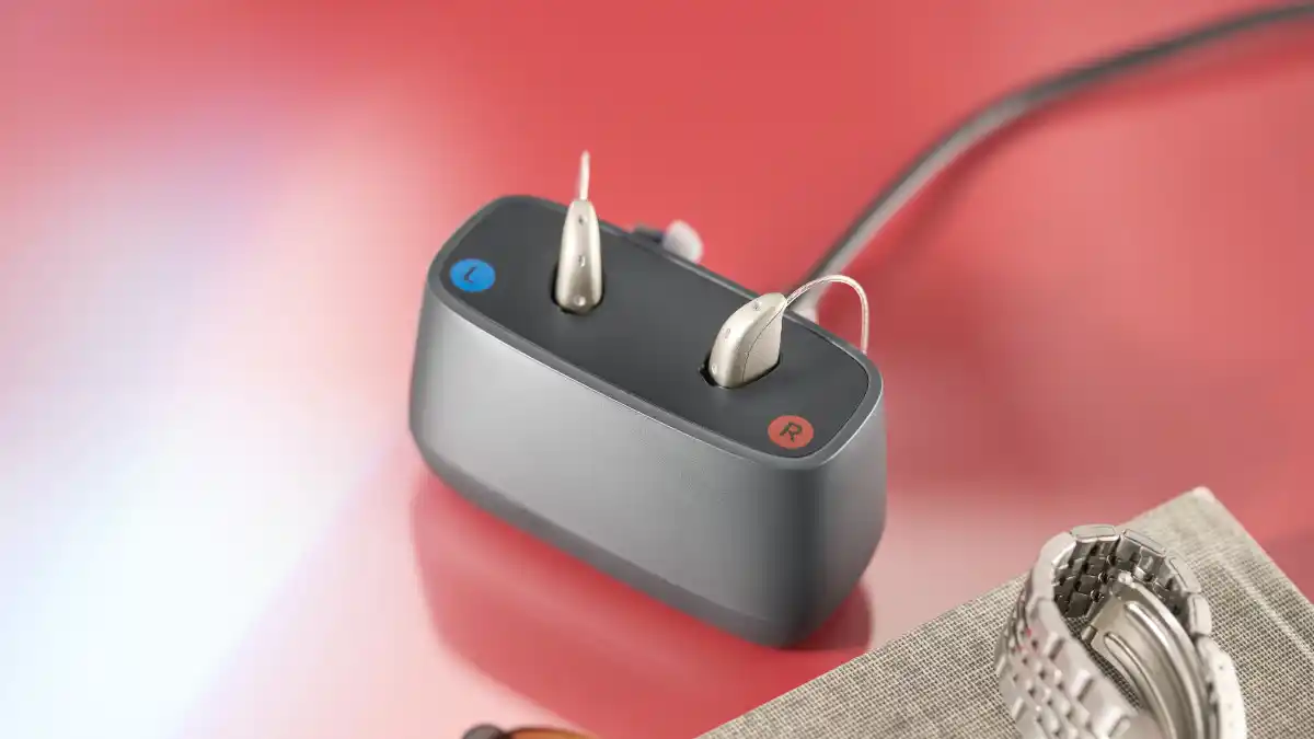 Savi RIE hearing aids in desktop charger