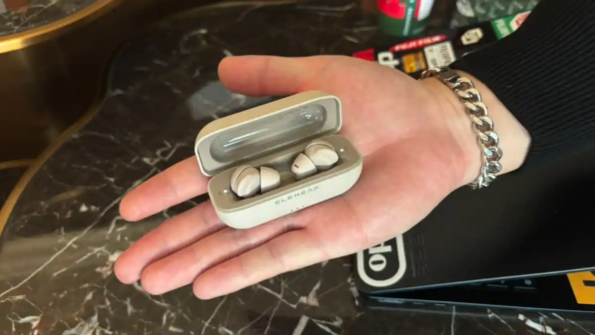 Elehear's VP of Sales Jeffery Teng reveals the new Elehear Delight OTC hearing aid in its palm-sized charging/carrying case that also stores two full charges.