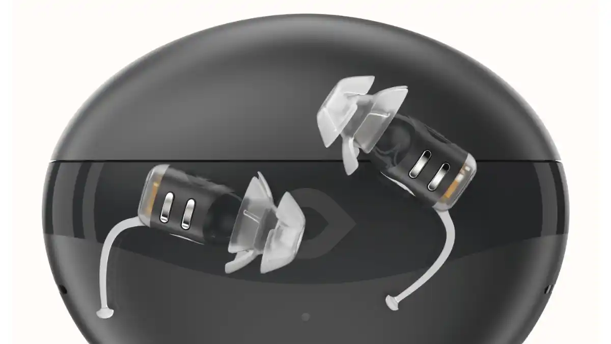 Eargo SE on top of portable charging case that carries up to five extra charges.