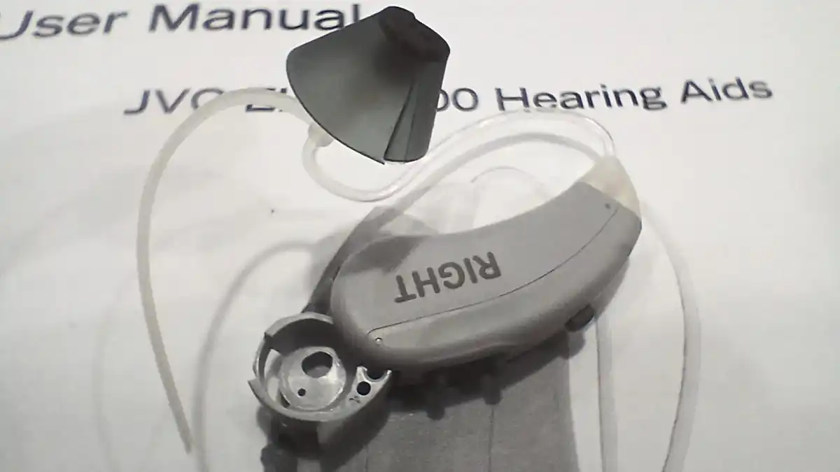 Closeup of the right JVC EH-Z1500 hearing aid with battery door open.