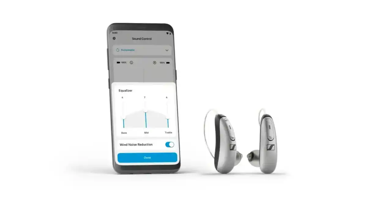 Smartphone and a pair of Sennheiser All-Day Clear OTC hearing aids