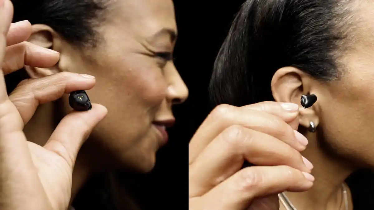 Small, black ITE and CIC hearing aids in woman's hands 