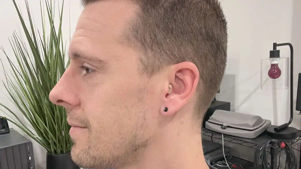 MDHearing Neo XS hearing aid on Dr. Taddei's ear