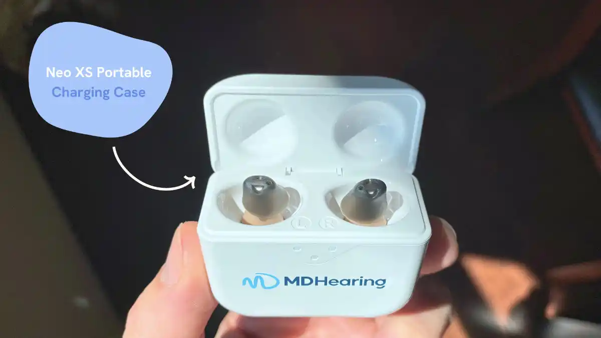 Set of two MDHearing Neo XS hearing aids in light blue charging case