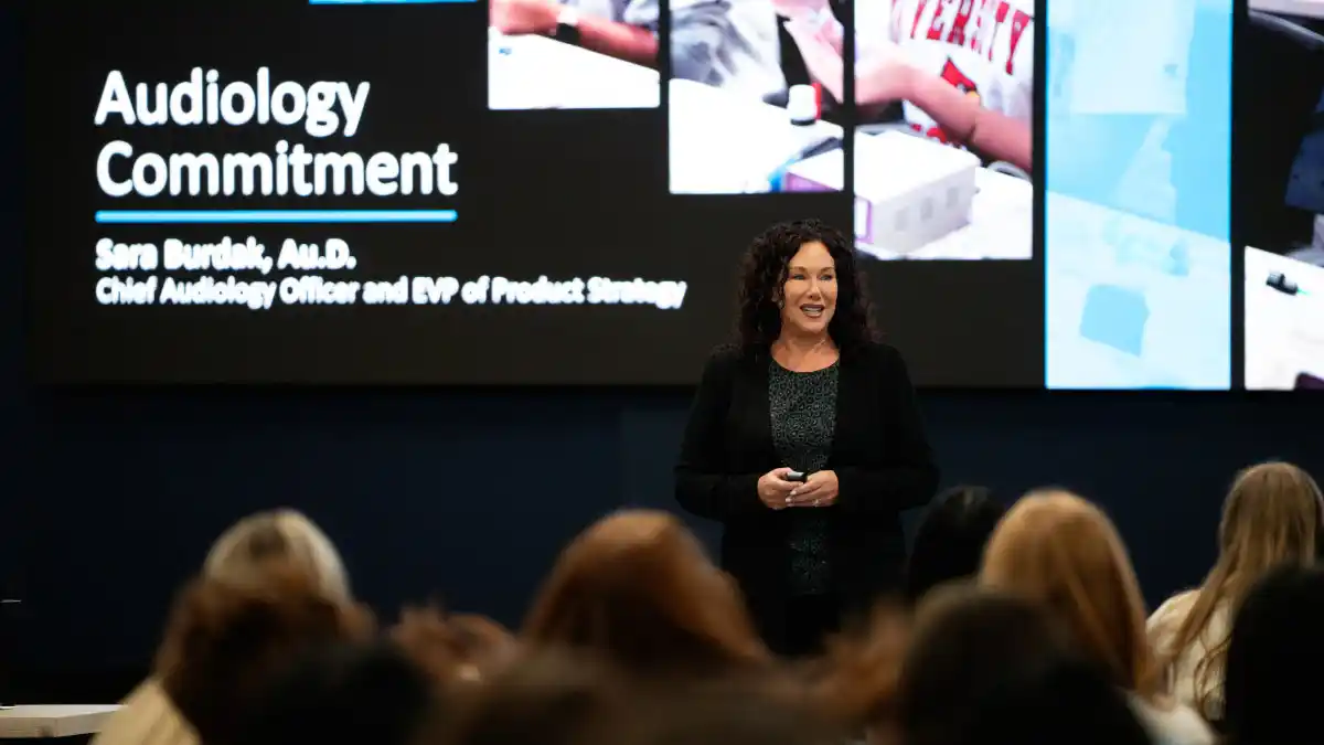 Sara Burdak, AuD, addresses students at the Starkey University Workshop.