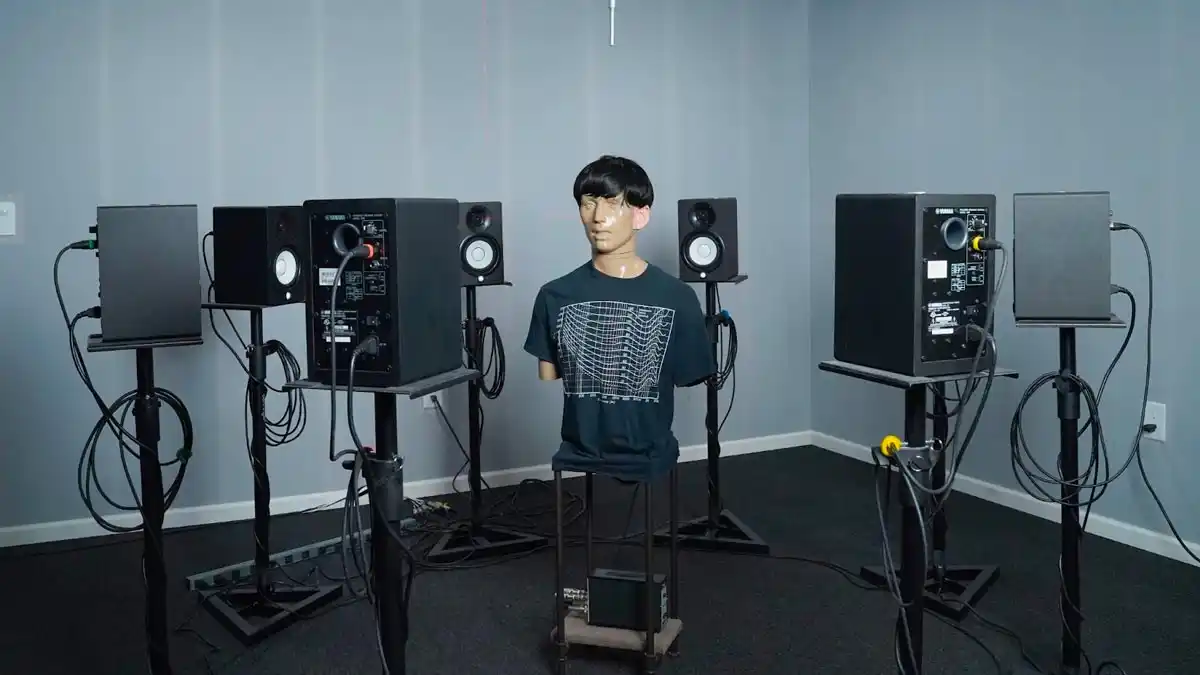 Figure 1: Test environment with KEMAR and Yamaha HS5 powered monitor 8 speaker array. 