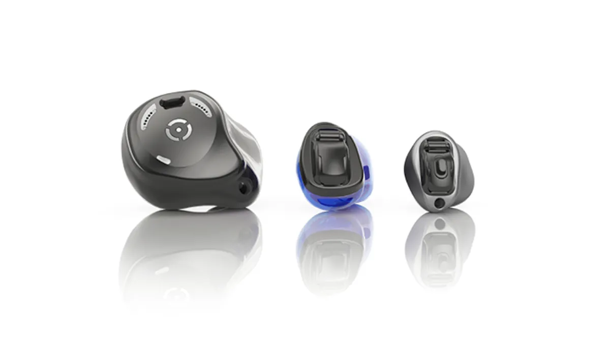 The three hearing aids in the Phonak Virto Infinio line (l to r): The Virto R rechargeable wireless in-the-ear (ITE), the battery-powered non-wireless completely in-canal (CIC), and titanium invisible-in-canal (IIC).