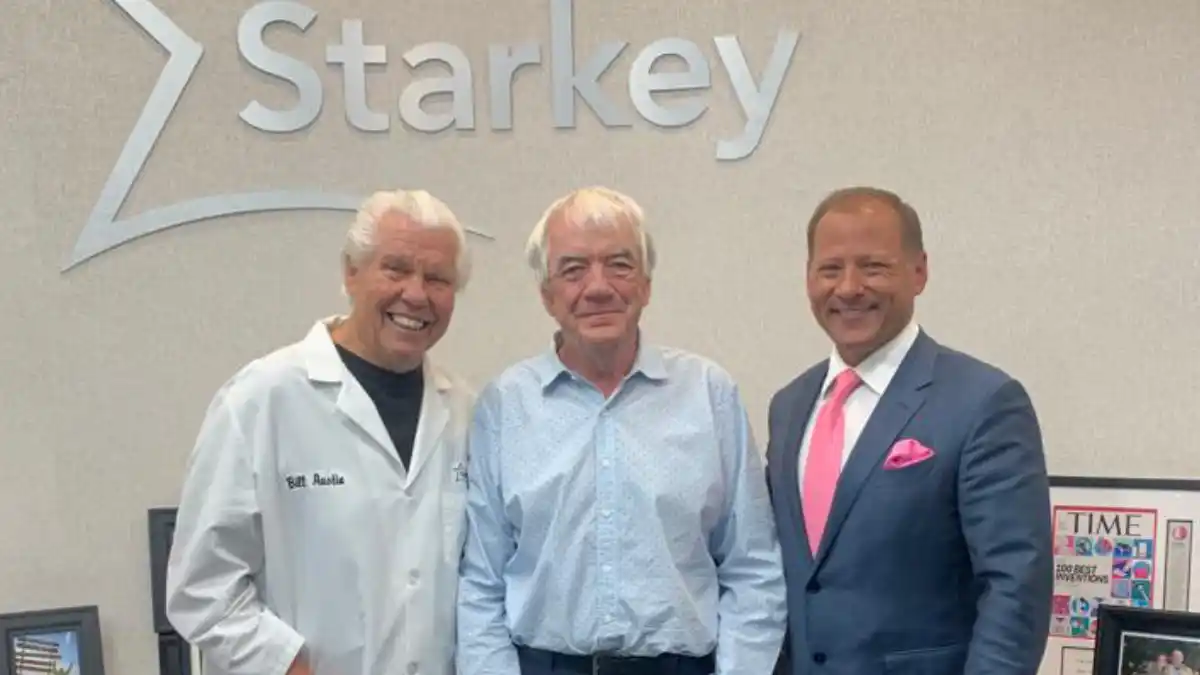 The author flanked by Starkey Founder Bill Austin and Brandon Sawalich at Starkey headquarters in Eden Prairie, Minn.
