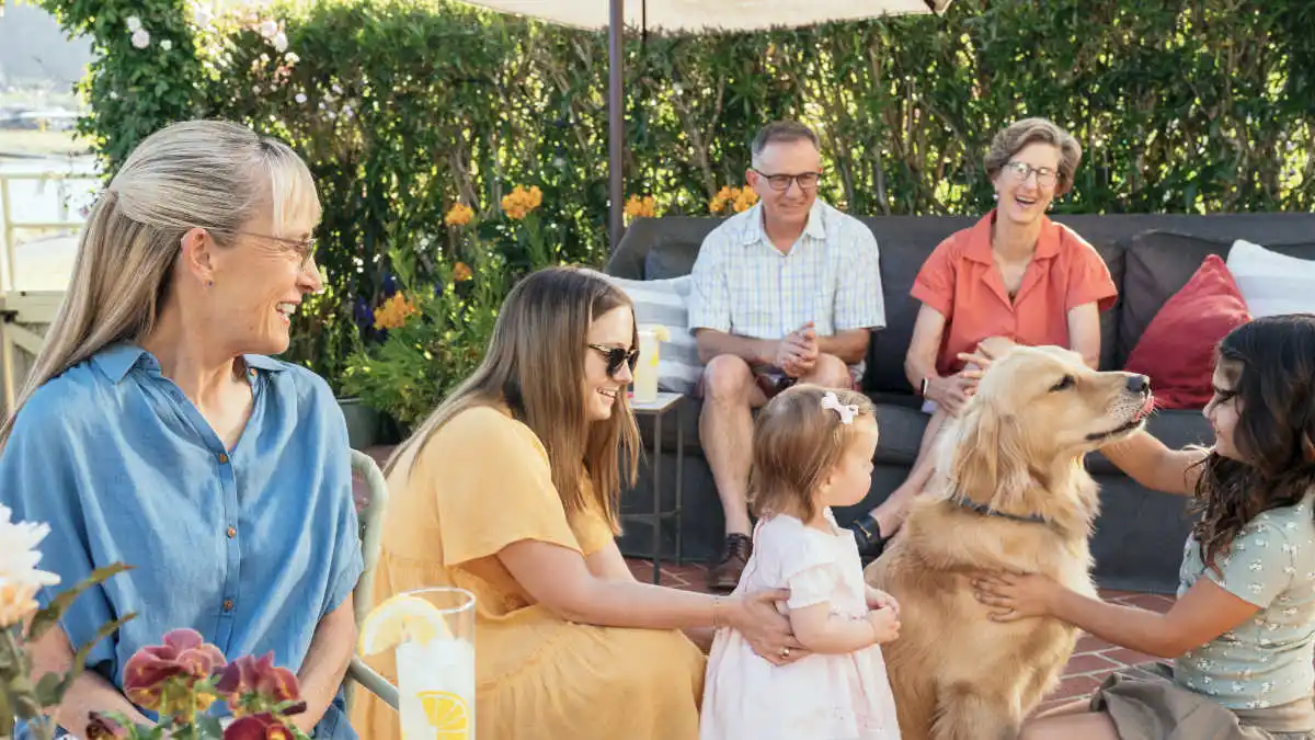 Photo of woman with hearing aids at garden party