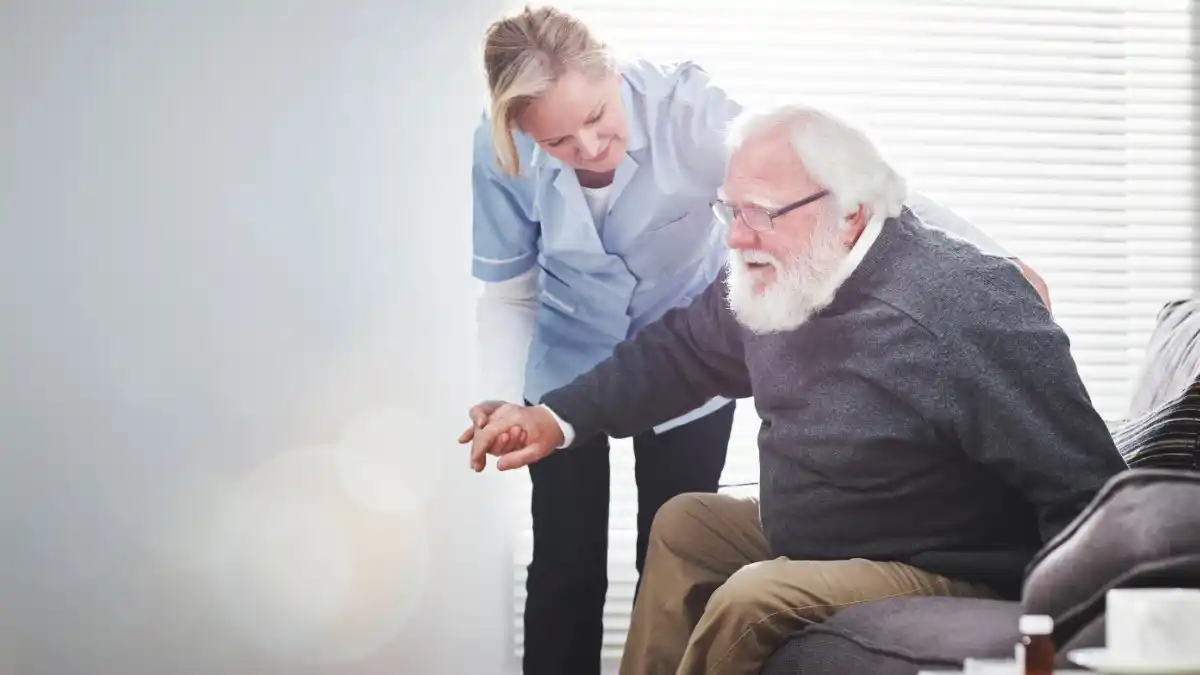 Older Man With Assistant Senior
