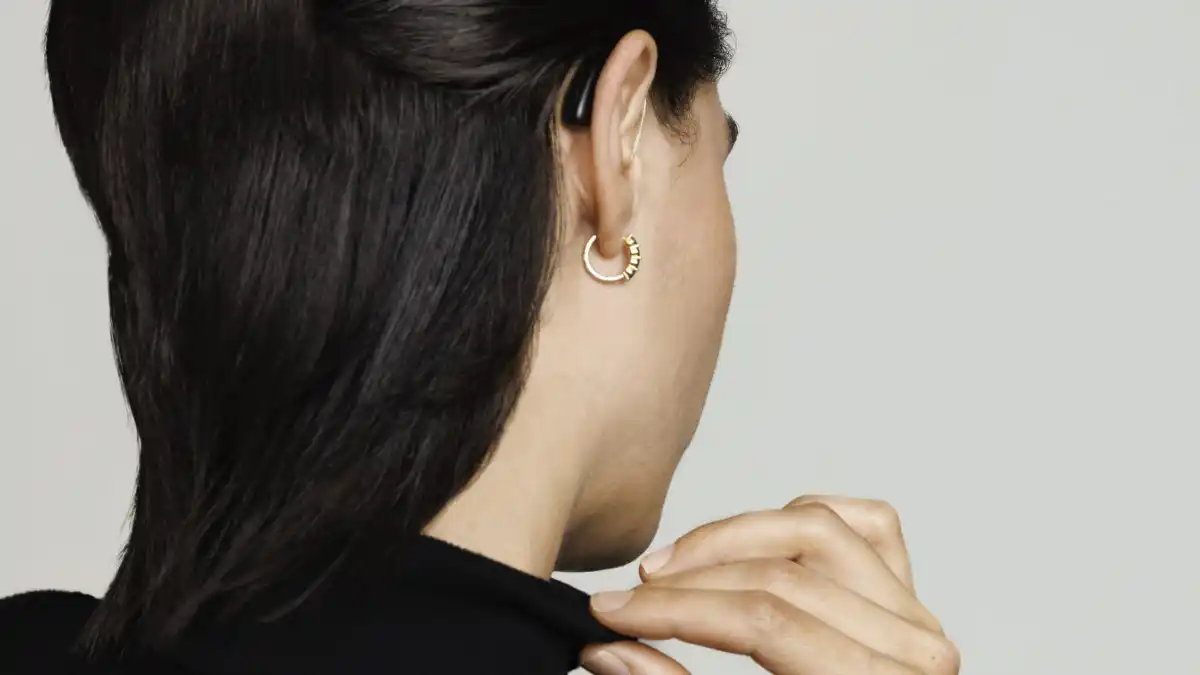 Lara Ricote's hearing aid pictured from behind her head