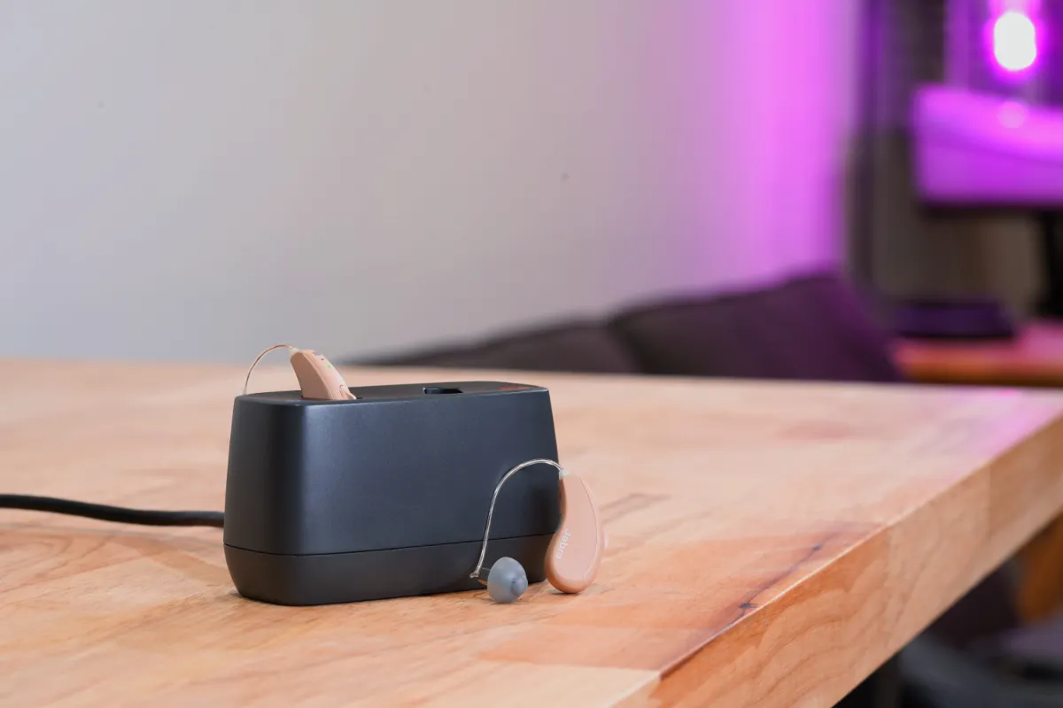 Jabra Enhance Select 50R and charger in the HearAdvisor lab. There is no internal power bank so the charger must be powered at all times via the included USB-C cable.