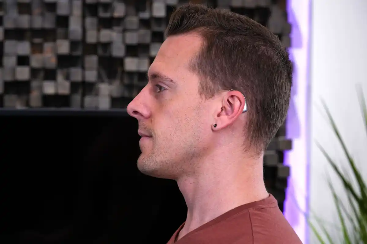 Infinio Ultra Sphere on Dr. Taddei's ears in HearAdvisor lab