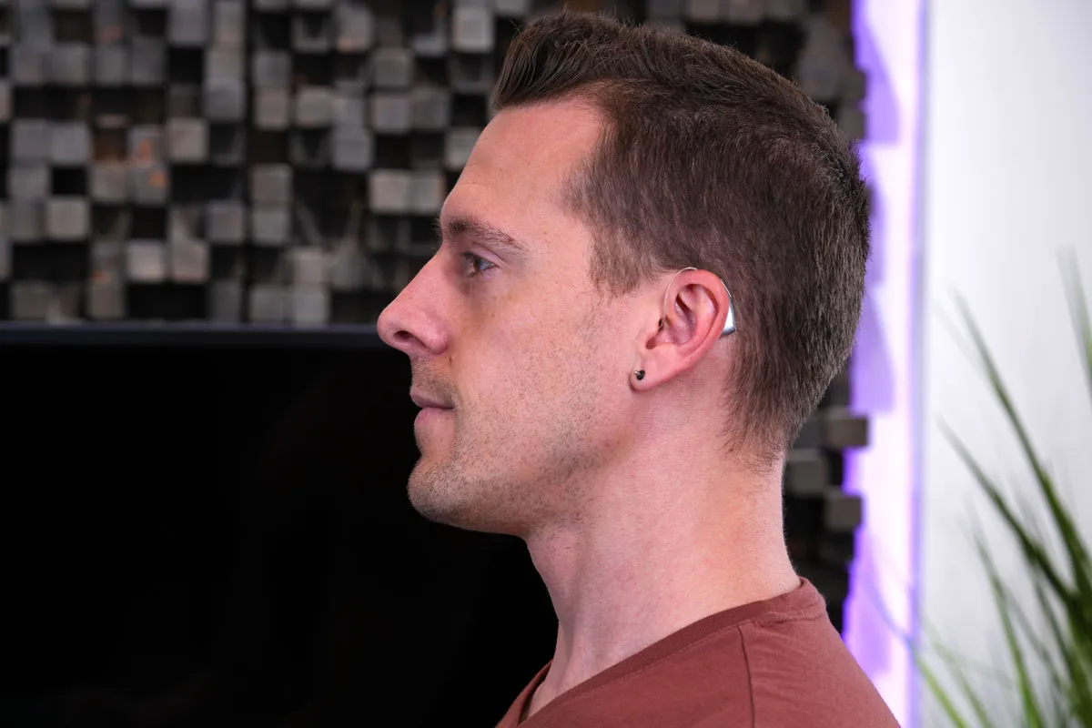 Infinio Ultra Sphere on Dr. Taddei's ears in HearAdvisor lab