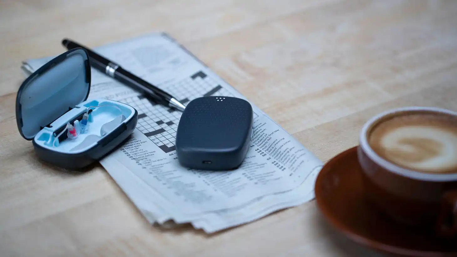 The Whisper hearing system with carrying case and brain.