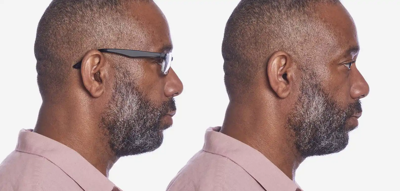 Demonstration of how a brown and black hearing aid faceplate looks on a man; the devices are almost invisible