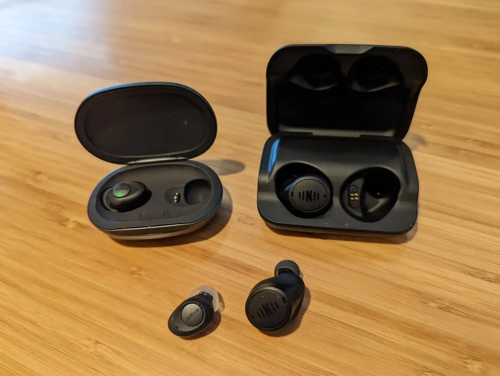 The Jabra Enhance Pro (left) and Nuheara IQ Buds2 Max (right) earbuds.