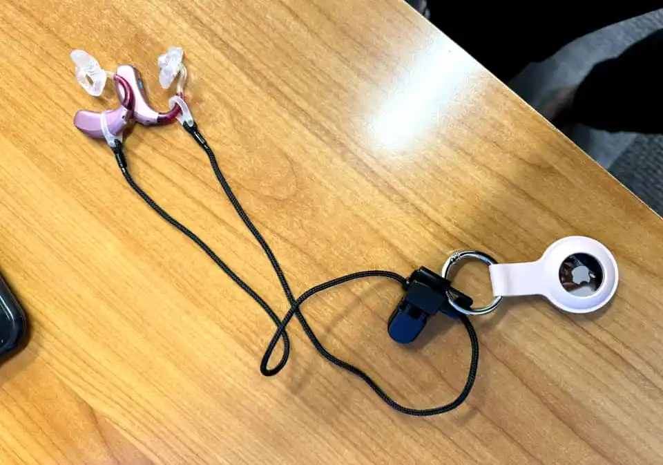 An Apple AirTag placed on an Otoclip can help you locate hearing aids that go missing.