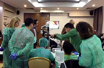 W&H piezosurgical devices under an operating dental microscope.