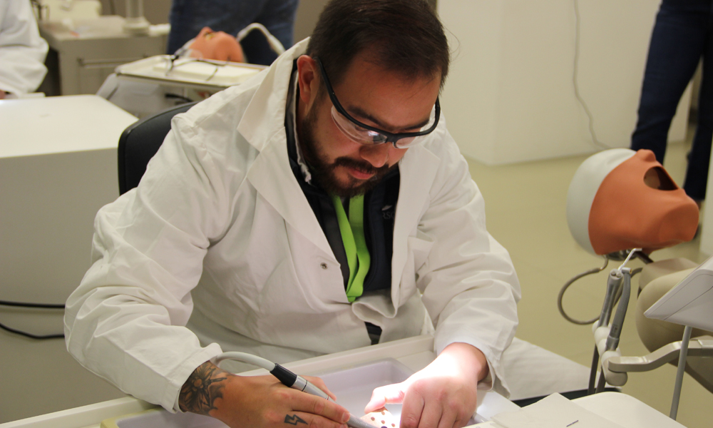 A visitor is testing an electric motor in the training room.