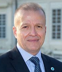 Prof. Dr Andreas Stavropoulos smiles at the camera.