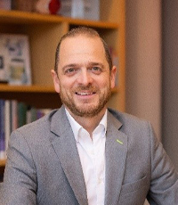 Andreas Brandstätter smiles at the camera.