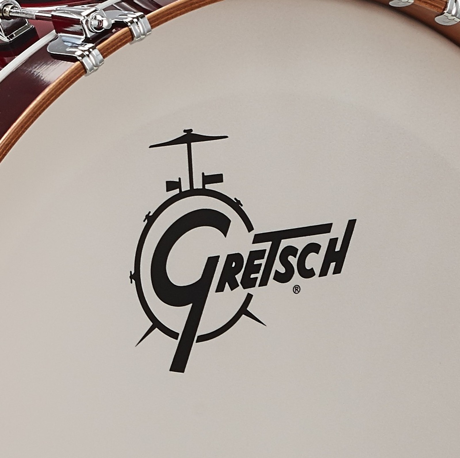 White bass drum resonant head with Gretsch logo