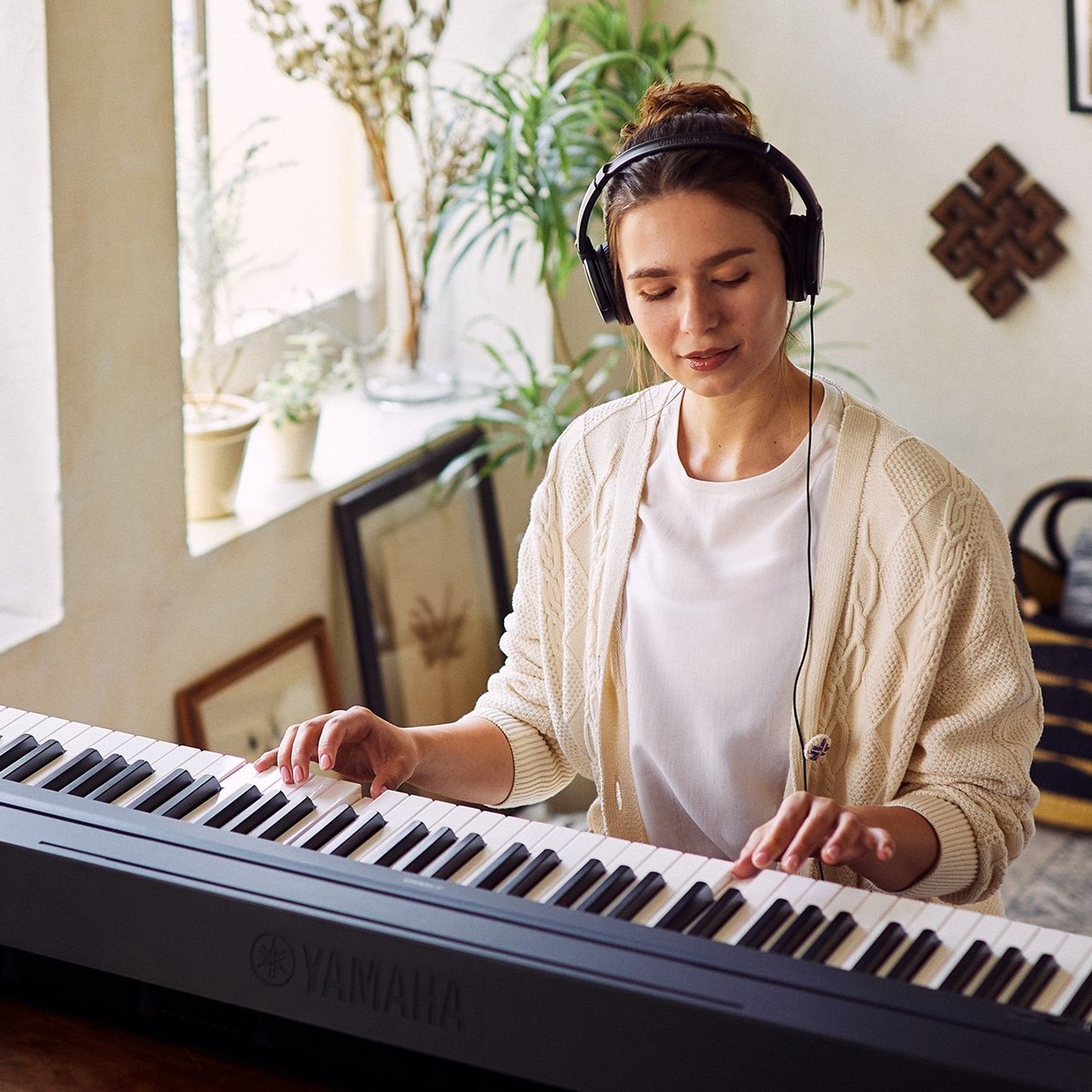 Pianist playing the Yamaha P45 B digital piano