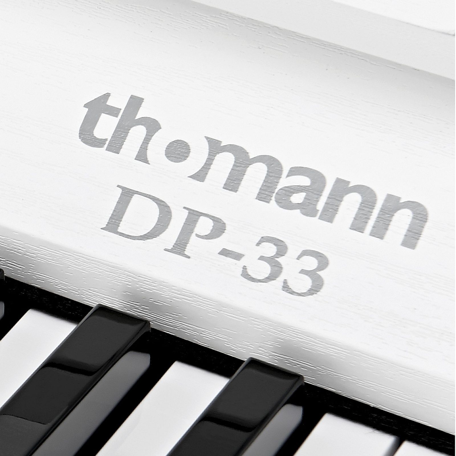 Thomann Logo on the DP-33 WH Compact Digital Piano
